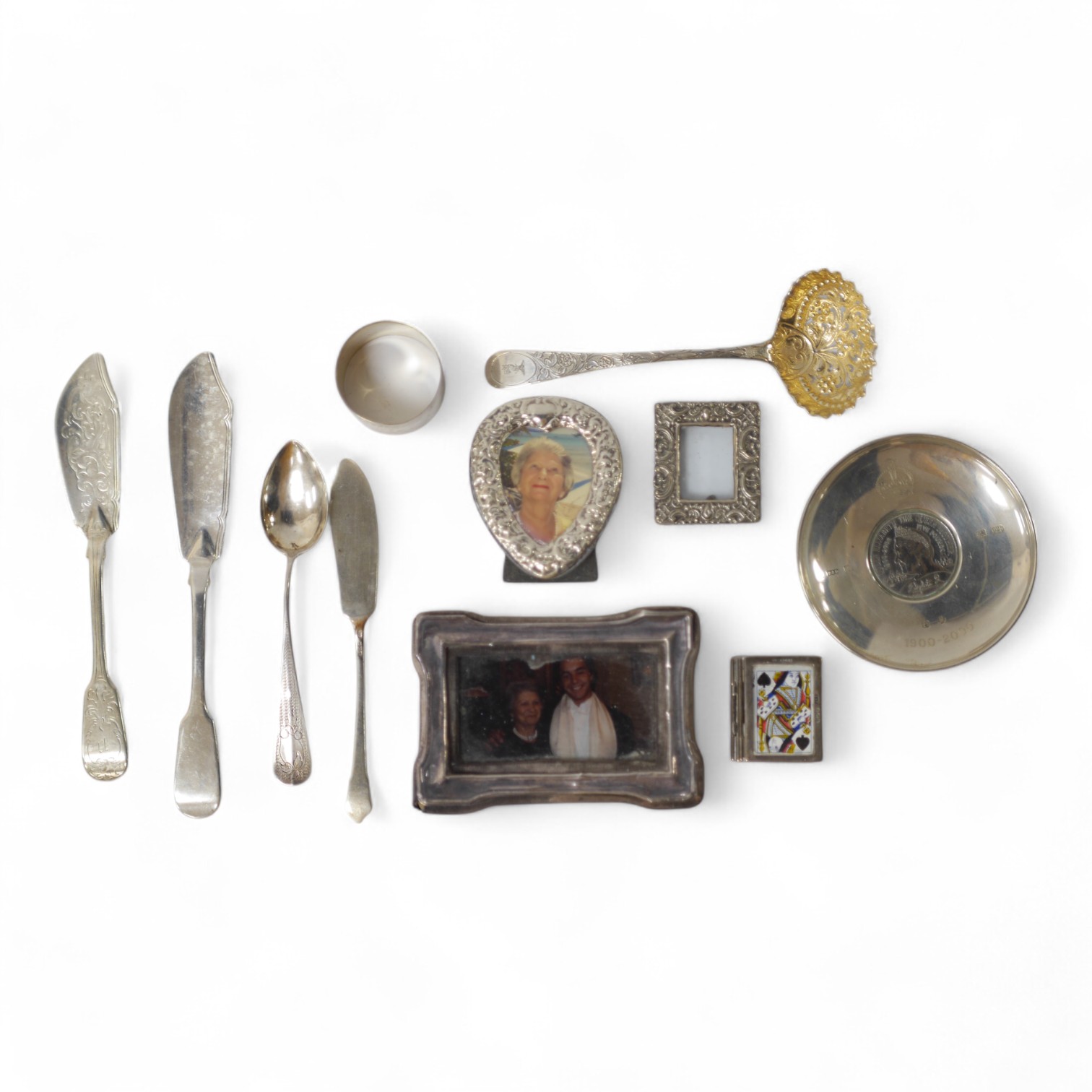 Four small mounted photograph frames, including a double by Saunders & Shepherd, Birmingham, 1905, 45mm, a silver dish, a silver napkin ring and five items of silver flatware. Condition - poor to fair